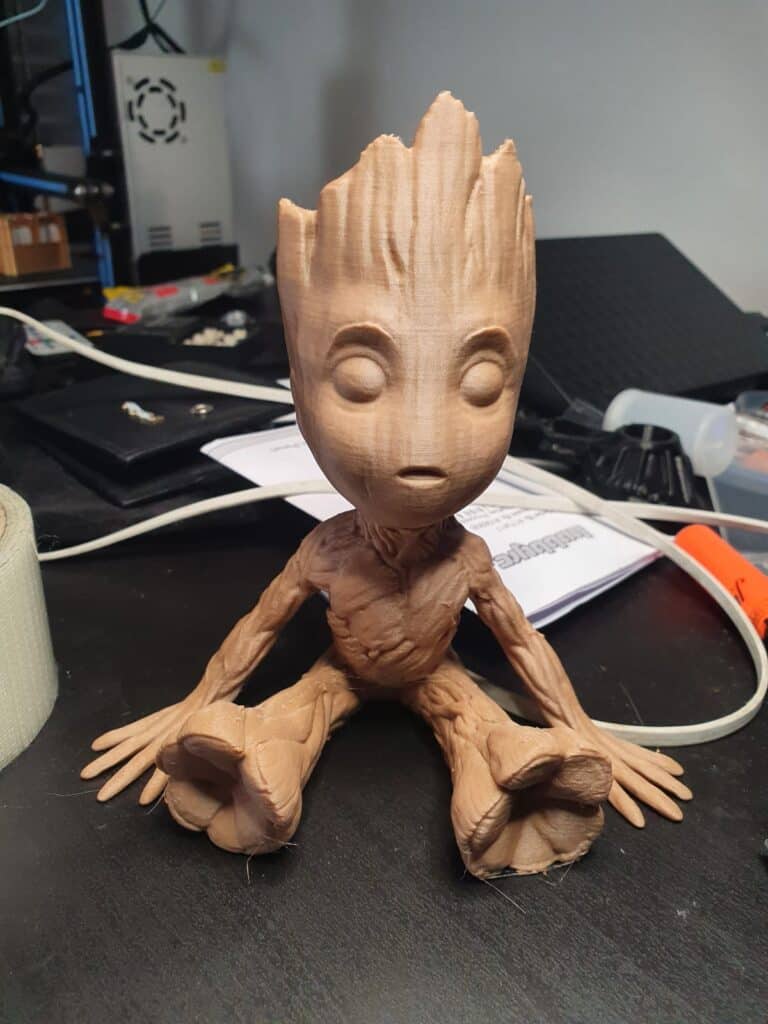 3D-printed Groot model on desk.