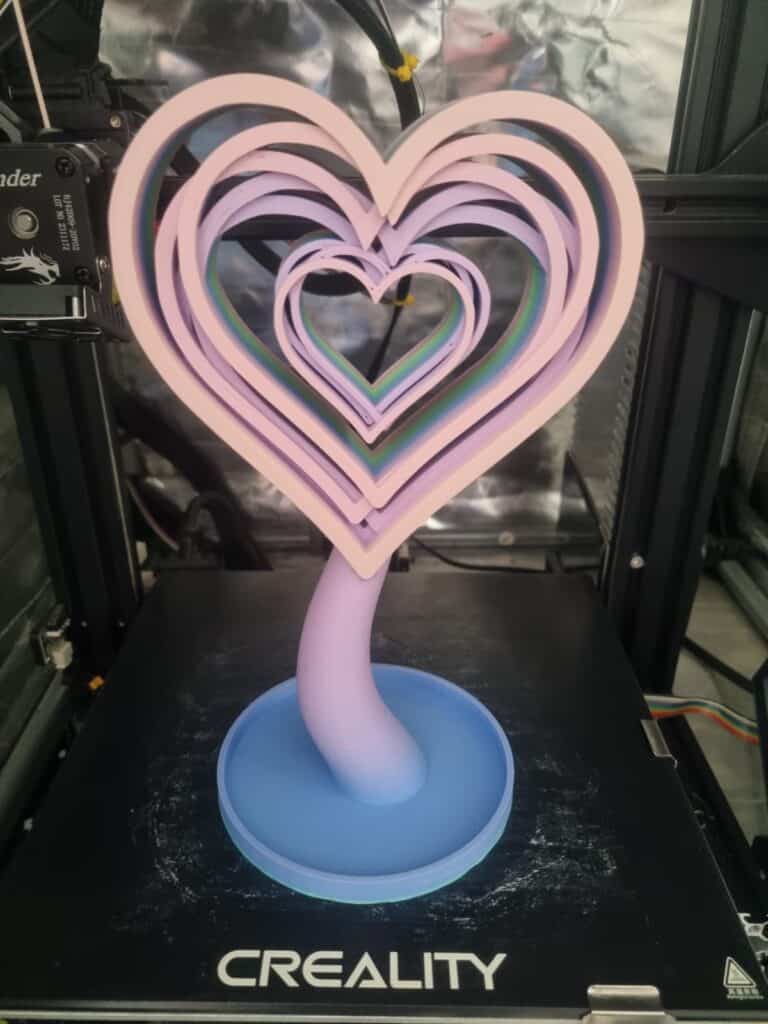 3D-printed multi-layered heart sculpture on printer bed.