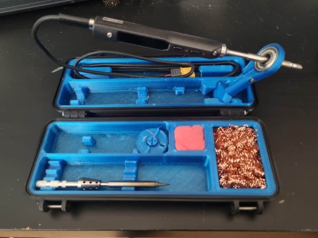 Soldering iron kit with tools and accessories in case.