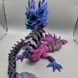 Colourful dragon figurine on white background