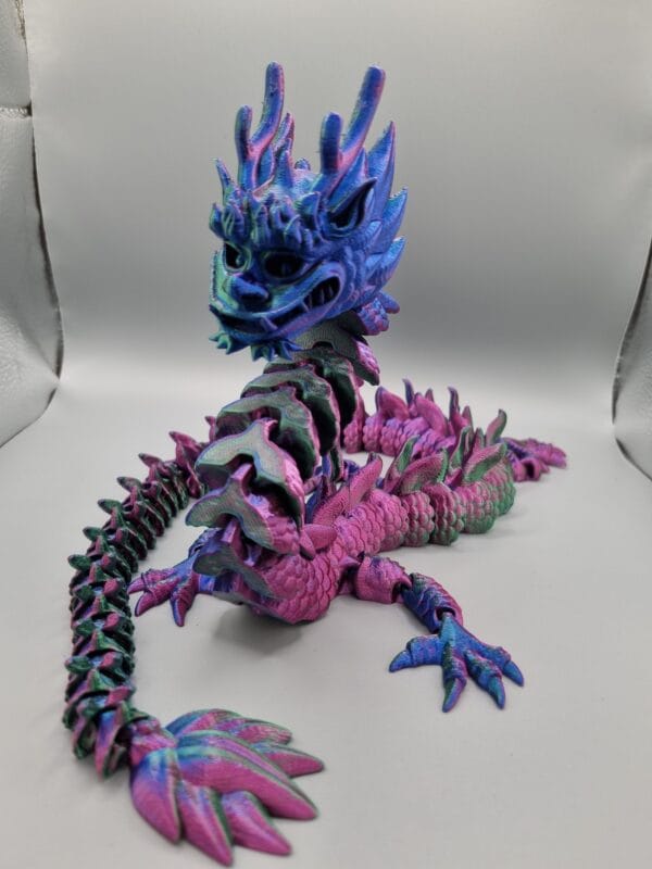 Colourful dragon figurine on white background