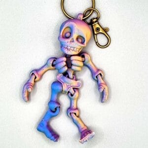 Iridescent skeleton keyring with gold clip
