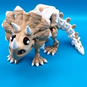 Cute triceratops skeleton toy on blue background