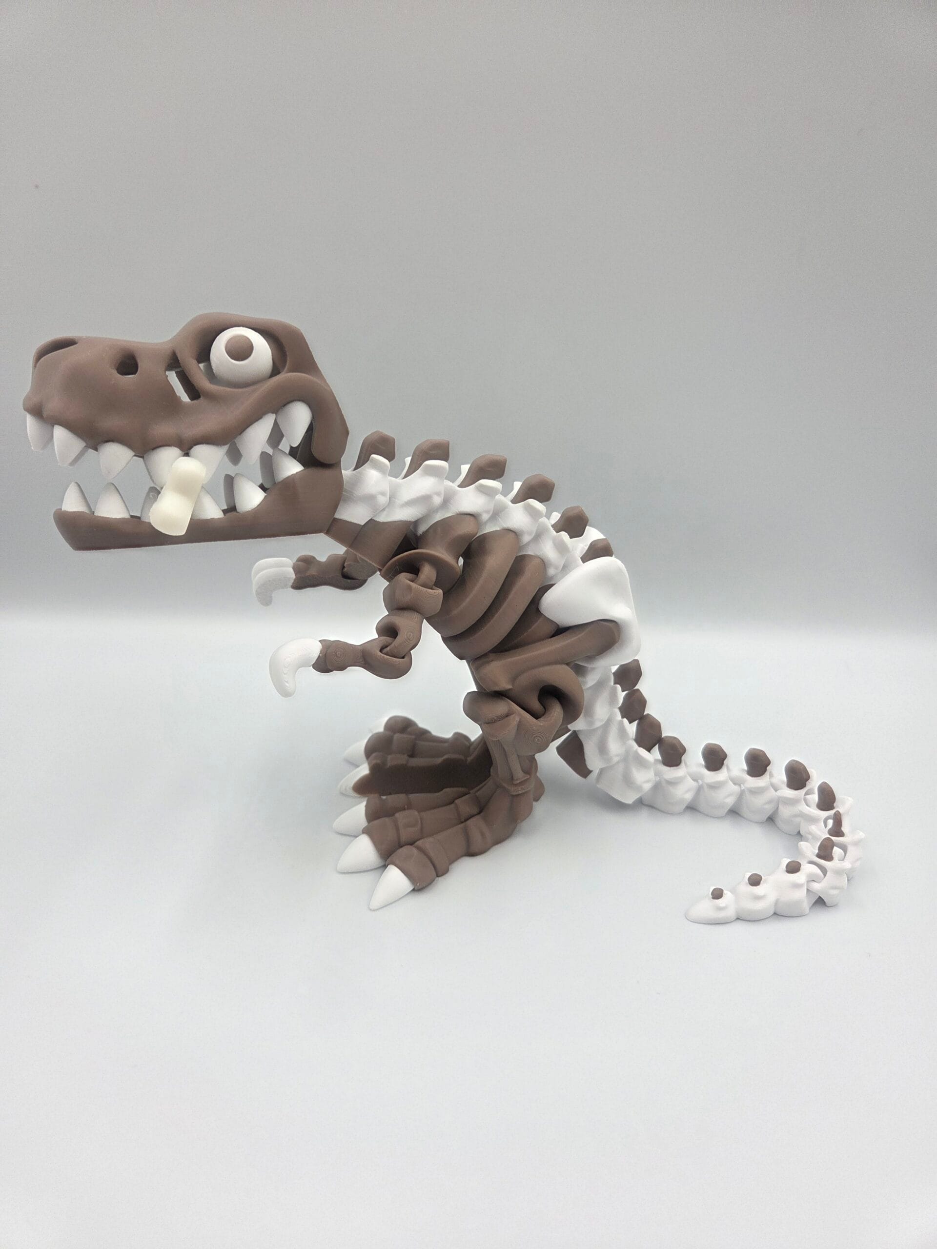 Brown and white 3D-printed dinosaur skeleton sculpture