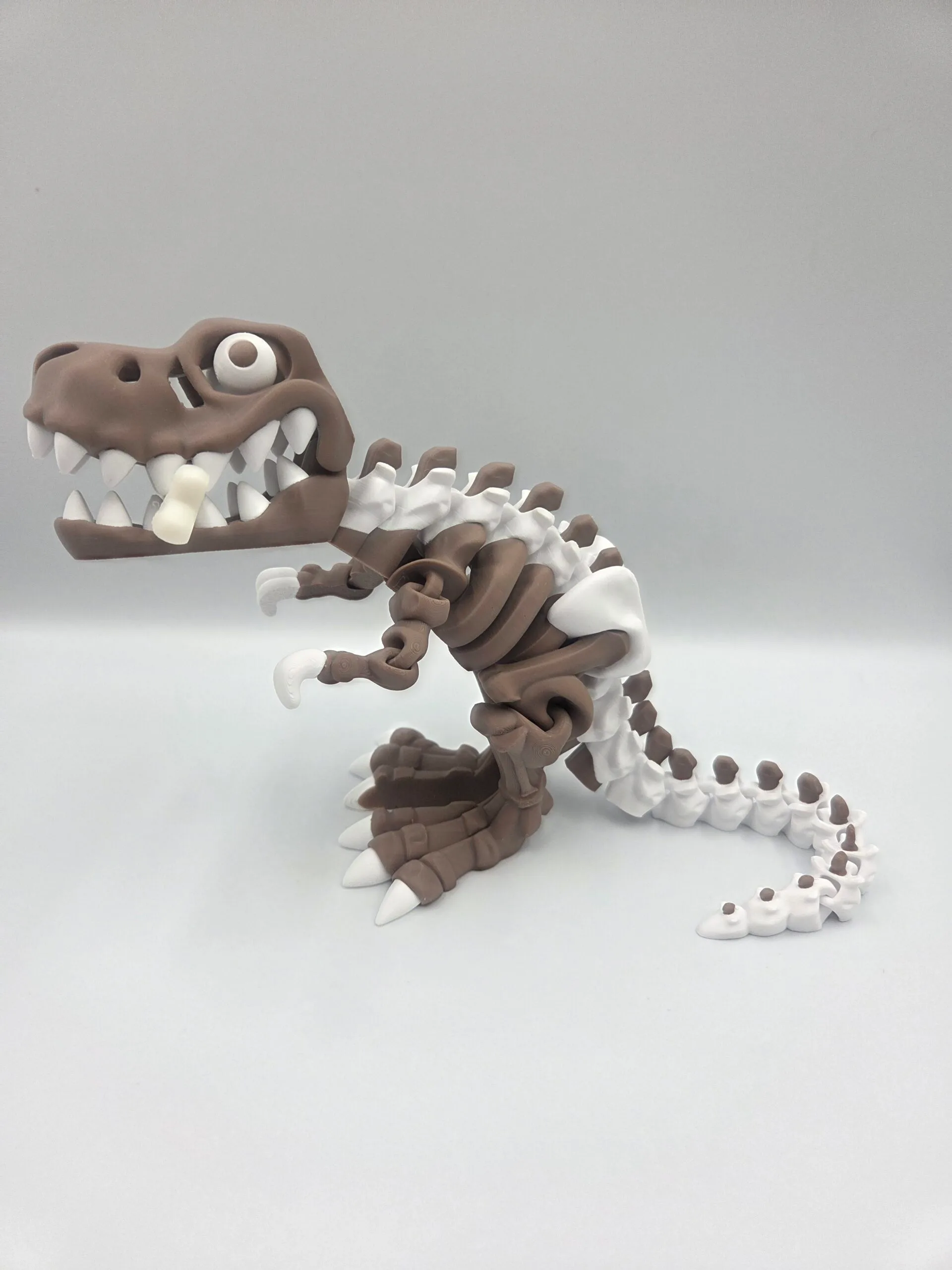 Brown and white 3D-printed dinosaur skeleton sculpture