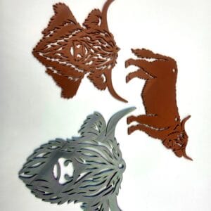 Three 3D printed Highland cow wall hangings in brown and grey