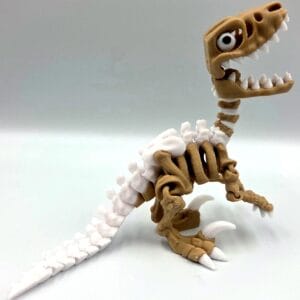 Articulated brown and white dinosaur skeleton figurine with one eye