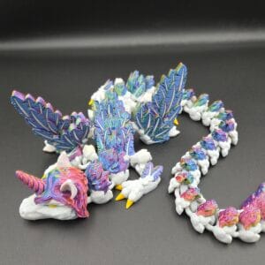 Colourful 3D-printed dragons perched on white cloud bases
